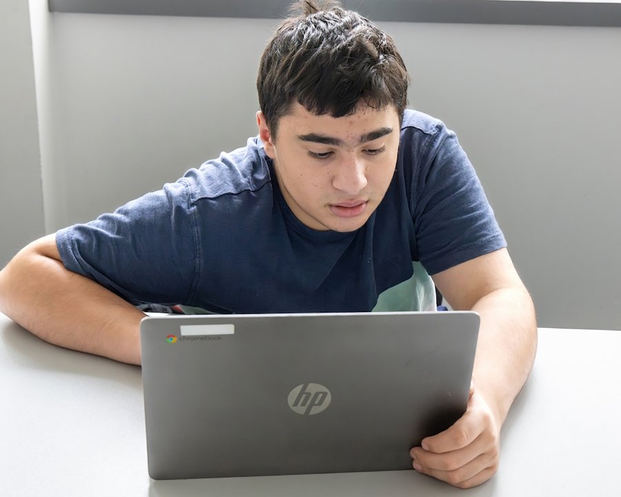 student working on a laptop