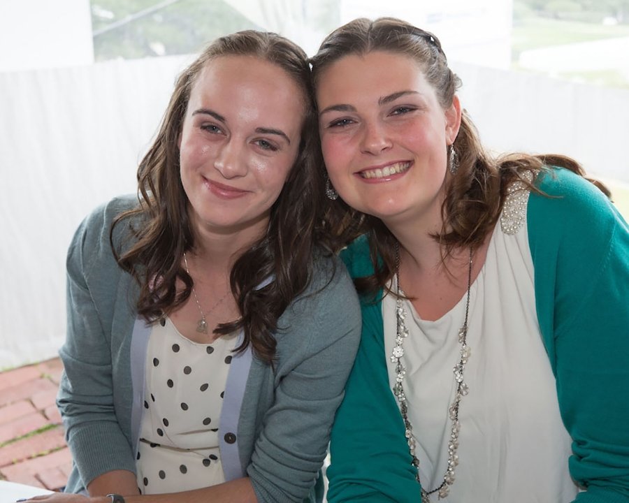two students touching heads together