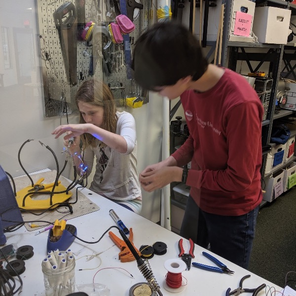 students working on wiring project in science lab