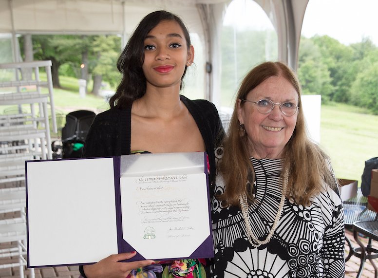 Graduating student with diploma and Jane