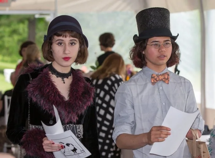 two students in formal clothes for graduation