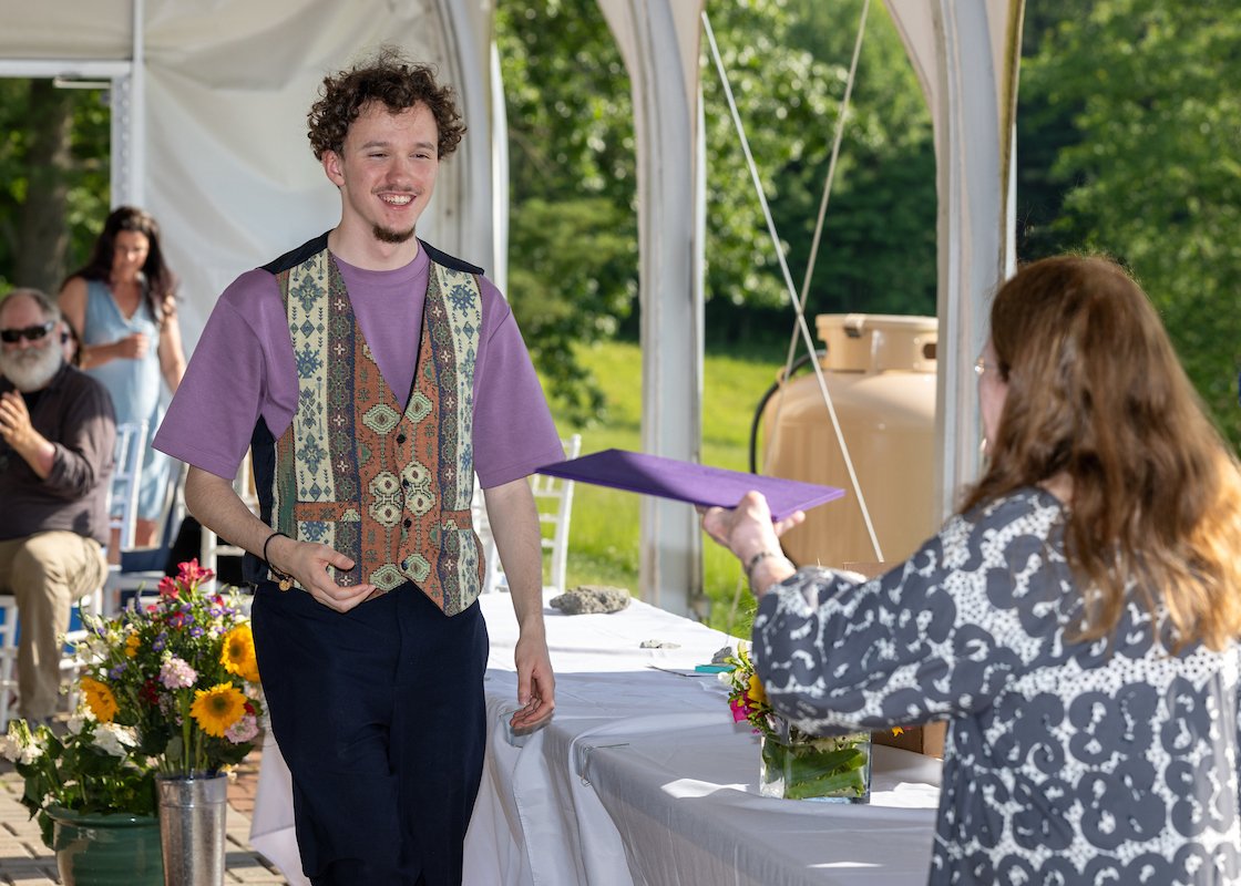 Student accepts diploma